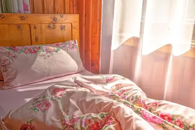 Ein Bett oder Betten in einem Zimmer der Unterkunft Chalet Rastenhof - Urlaub auf dem Bauernhof in Österreich