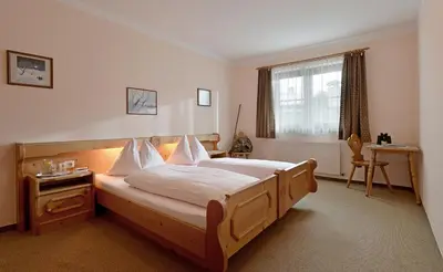 Ein Bett oder Betten in einem Zimmer der Unterkunft Café Rainer