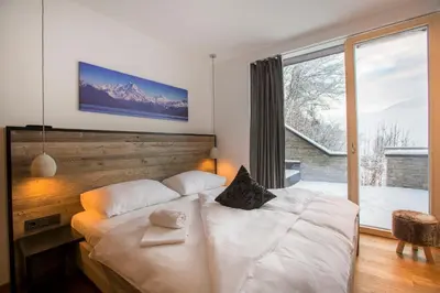 Ein Bett oder Betten in einem Zimmer der Unterkunft Penthaus Kitzebüheler Alpen