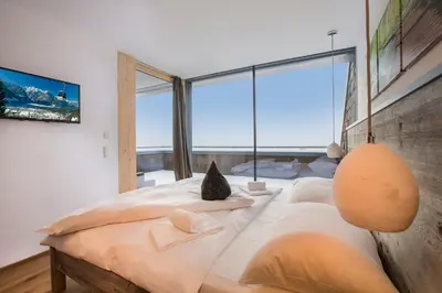 Ein Bett oder Betten in einem Zimmer der Unterkunft Penthaus Kitzebüheler Alpen