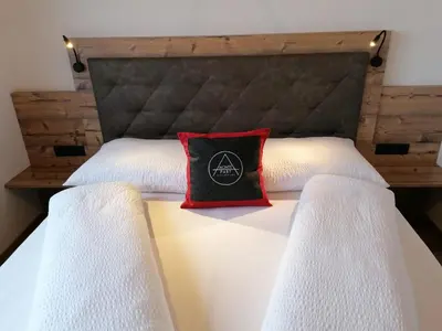 Ein Bett oder Betten in einem Zimmer der Unterkunft Montepart Zillertal