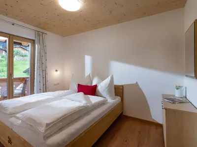 Ein Bett oder Betten in einem Zimmer der Unterkunft Appartements Bichldorf