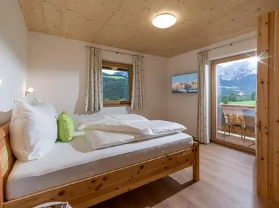 Ein Bett oder Betten in einem Zimmer der Unterkunft Appartements Bichldorf