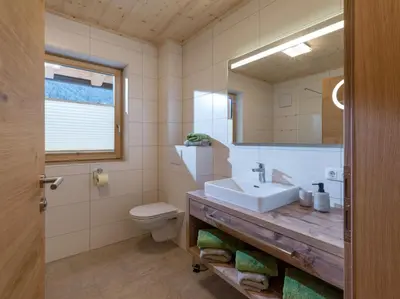 Ein Badezimmer in der Unterkunft Appartements Bichldorf