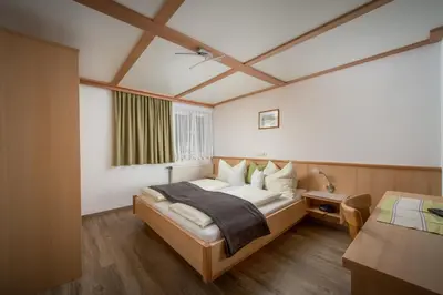 Ein Bett oder Betten in einem Zimmer der Unterkunft Ferienwohnungen Vordergriess