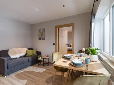 Ein Sitzbereich in der Unterkunft Tirol Appartements Schwaiger