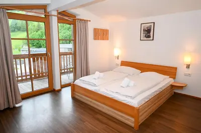 Ein Bett oder Betten in einem Zimmer der Unterkunft Appartementhaus Kristall incl Joker Card by All in One Apartments