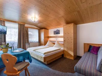 Ein Bett oder Betten in einem Zimmer der Unterkunft Gästehaus Roland