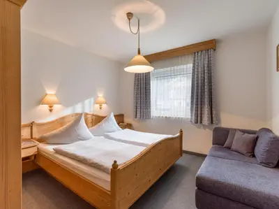 Ein Bett oder Betten in einem Zimmer der Unterkunft Gästehaus Roland