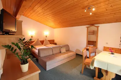 Ein Bett oder Betten in einem Zimmer der Unterkunft Gästehaus Roland