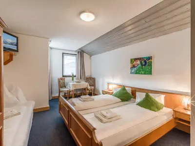 Ein Bett oder Betten in einem Zimmer der Unterkunft Pension Konrad