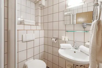 Ein Badezimmer in der Unterkunft Pension Konrad
