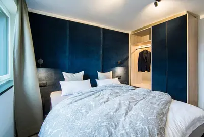 Ein Bett oder Betten in einem Zimmer der Unterkunft RIDERS Suite