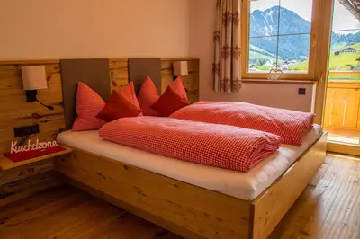 Ein Bett oder Betten in einem Zimmer der Unterkunft Sonnenappartements Madlstatthof