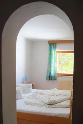 Ein Bett oder Betten in einem Zimmer der Unterkunft Hochfilz´ner Hof