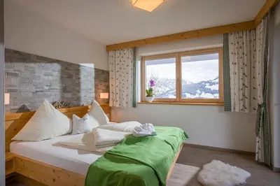 Ein Bett oder Betten in einem Zimmer der Unterkunft Alpenchalet Zillertal