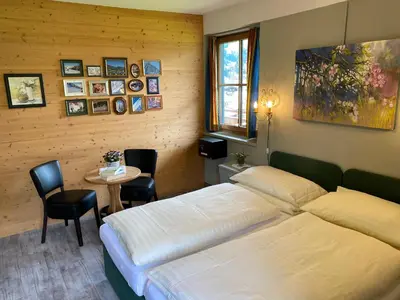 Ein Bett oder Betten in einem Zimmer der Unterkunft Hotel Edelweiss Kitzbühel