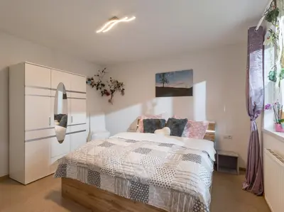 Ein Bett oder Betten in einem Zimmer der Unterkunft Haus Yvonne