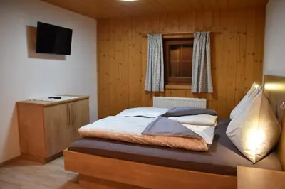 Ein Bett oder Betten in einem Zimmer der Unterkunft Bacherhof