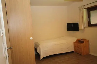 Ein Bett oder Betten in einem Zimmer der Unterkunft Hoss