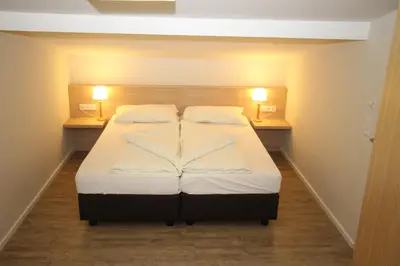 Ein Bett oder Betten in einem Zimmer der Unterkunft Hoss