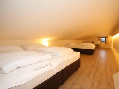 Ein Bett oder Betten in einem Zimmer der Unterkunft Hoss