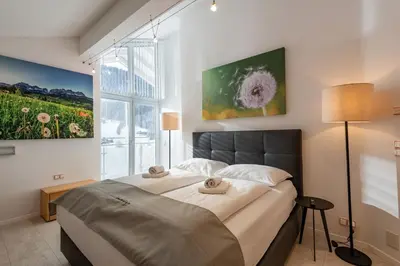 Ein Bett oder Betten in einem Zimmer der Unterkunft Ferienhaus Au Villa