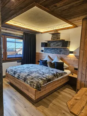 Ein Bett oder Betten in einem Zimmer der Unterkunft Luxus Apartment Nina mit Zirbenhütte