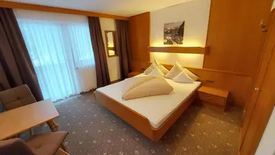 Ein Bett oder Betten in einem Zimmer der Unterkunft Zeitlos Apartments - Gerlos