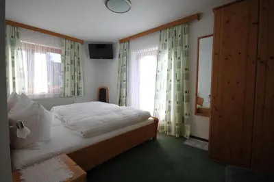 Ein Bett oder Betten in einem Zimmer der Unterkunft Pension Aberger
