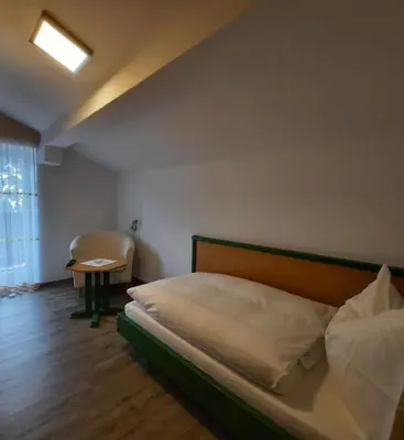 Ein Bett oder Betten in einem Zimmer der Unterkunft Pension Aberger