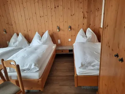 Ein Bett oder Betten in einem Zimmer der Unterkunft Pension Aberger