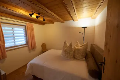 Ein Bett oder Betten in einem Zimmer der Unterkunft Saukaserstub'n Apartments - Ferienwohnung Schützkogel