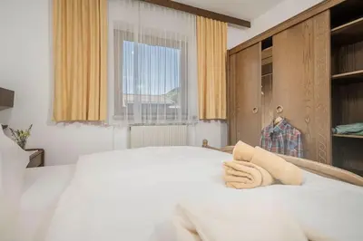 Ein Bett oder Betten in einem Zimmer der Unterkunft Alpenrose