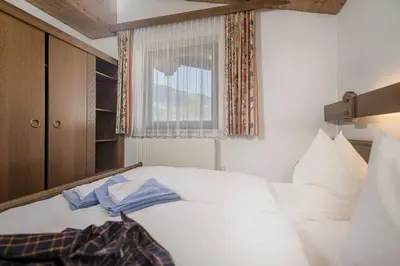 Ein Bett oder Betten in einem Zimmer der Unterkunft Alpenrose