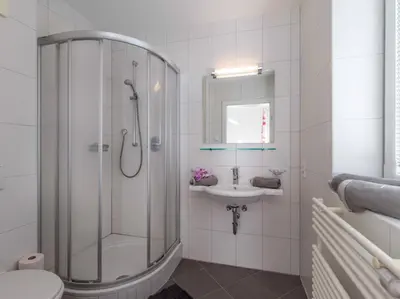 Ein Badezimmer in der Unterkunft Apartments Kolmblick