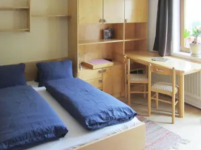 Ein Bett oder Betten in einem Zimmer der Unterkunft Chalet in Krimml near Waterfalls
