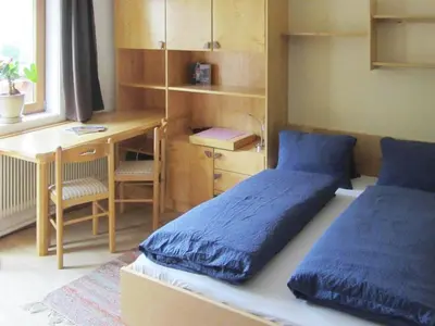 Ein Bett oder Betten in einem Zimmer der Unterkunft Chalet in Krimml near Waterfalls