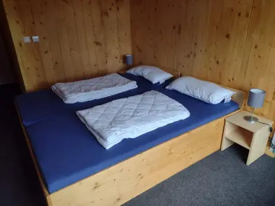 Ein Bett oder Betten in einem Zimmer der Unterkunft Jugendgästehaus Gerlosplatte