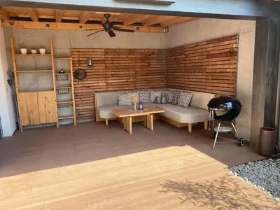 Ein Sitzbereich in der Unterkunft Mona Apartment