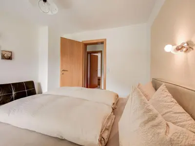 Ein Bett oder Betten in einem Zimmer der Unterkunft Apartment in Hainzenberg near Ski Lift
