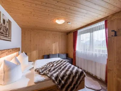 Ein Bett oder Betten in einem Zimmer der Unterkunft Ferienwohnung Knabl
