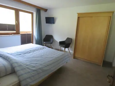 Ein Bett oder Betten in einem Zimmer der Unterkunft Alpenhaus Denver