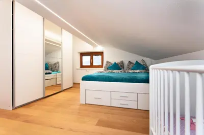 Ein Bett oder Betten in einem Zimmer der Unterkunft Ferienwohnung Steinplatte
