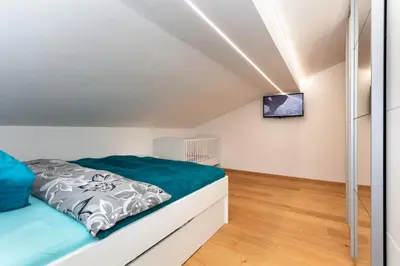 Ein Bett oder Betten in einem Zimmer der Unterkunft Ferienwohnung Steinplatte