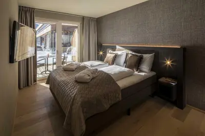 Ein Bett oder Betten in einem Zimmer der Unterkunft Berg & Golf Resort Westendorf by ALPS RESORTS