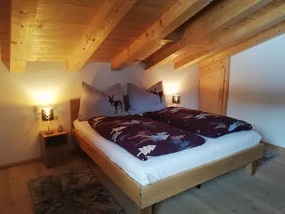 Ein Bett oder Betten in einem Zimmer der Unterkunft Hahnenkammblick