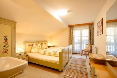 Ein Bett oder Betten in einem Zimmer der Unterkunft Gästehaus Waldruh