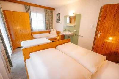 Ein Bett oder Betten in einem Zimmer der Unterkunft Gästehaus Waldruh