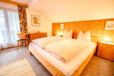 Ein Bett oder Betten in einem Zimmer der Unterkunft Gästehaus Waldruh